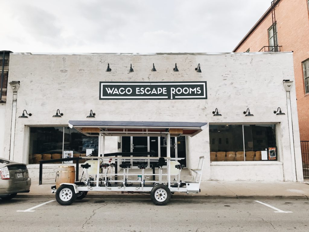 Waco Pedal Tours bike in front of Waco Escape Rooms in downtown Waco