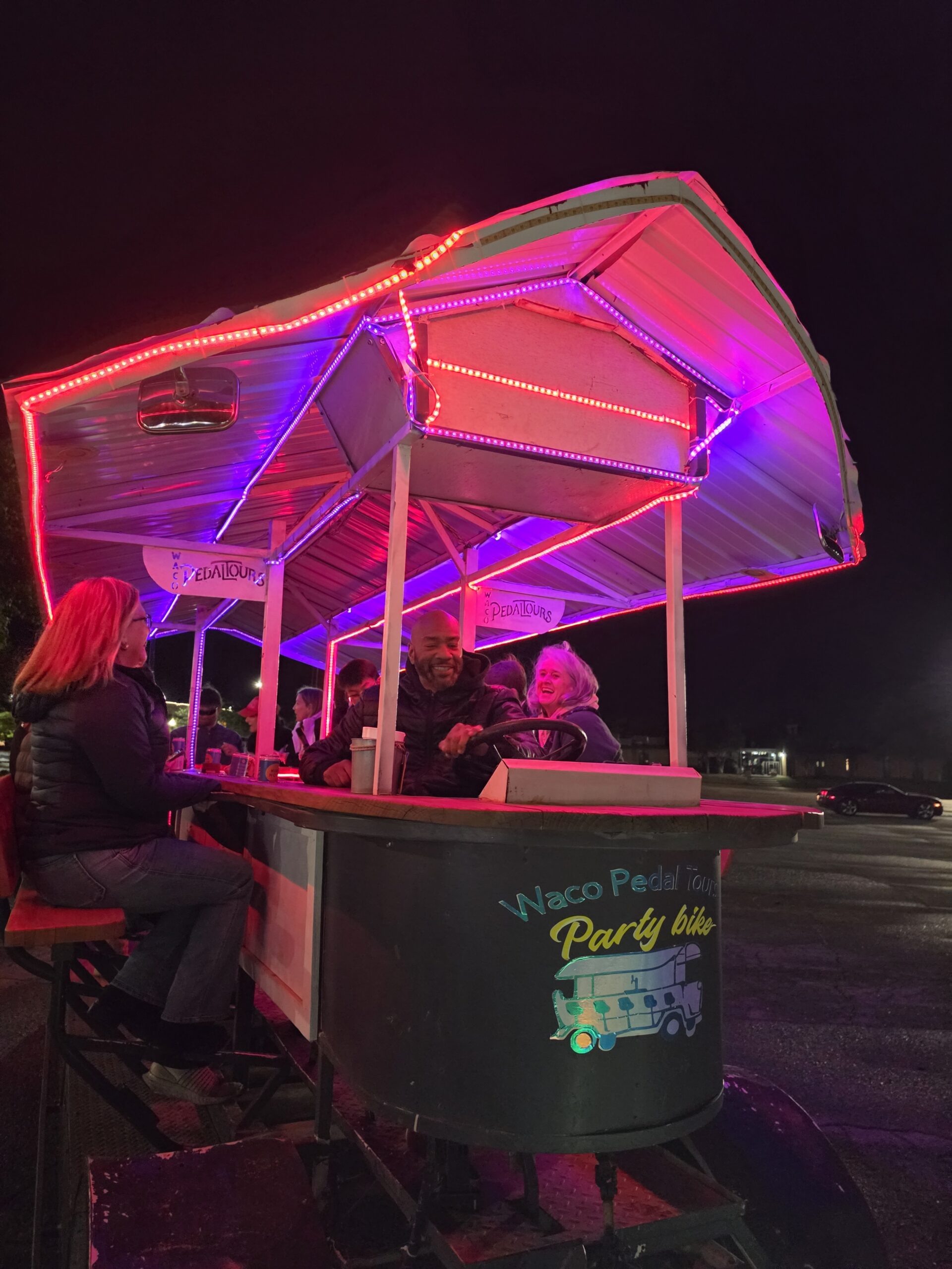 Waco Pedal Tours party bike night ride with yellow holiday lights